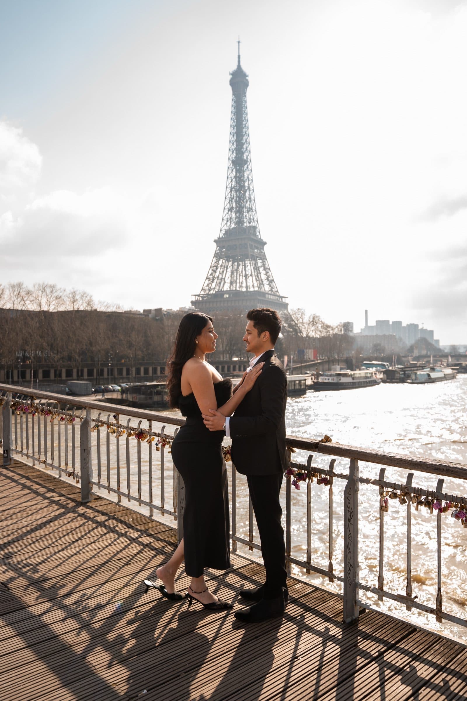 A couple photographed at the Eiffel Tower at golden hour